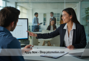 Professional banker working in a Spanish bank office representing Bank Jobs in Spain 2026 opportunities.